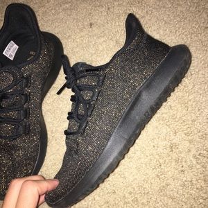 Rare black and gold adidas tubular shoes